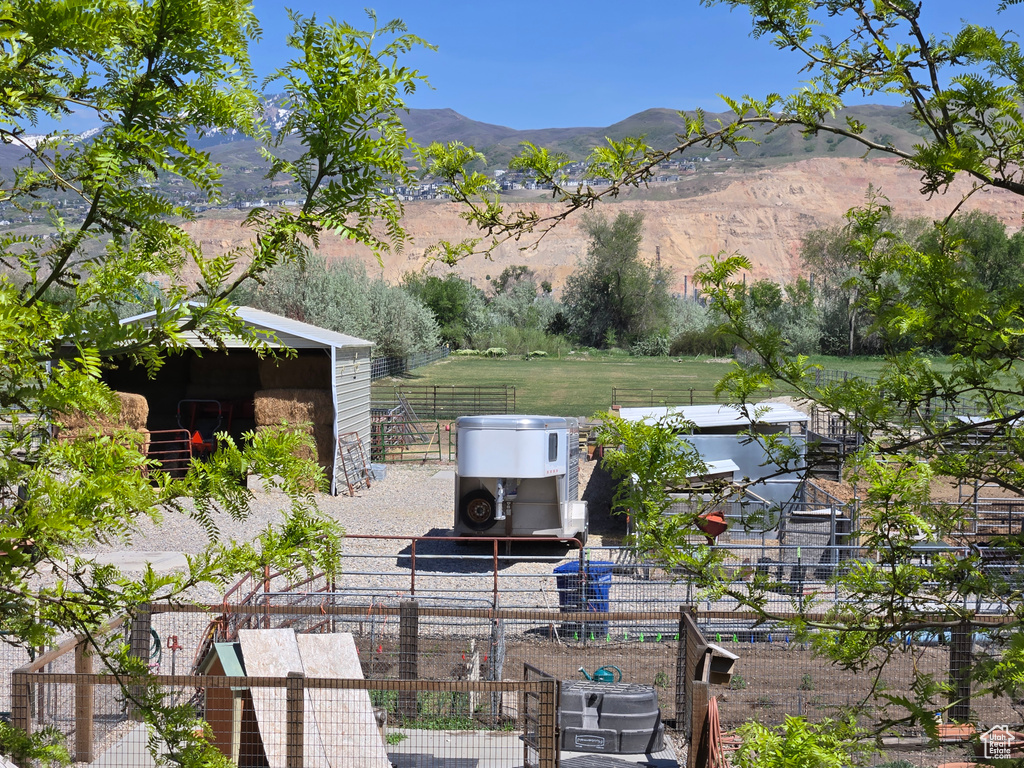 View of yard with fence and a mountain view