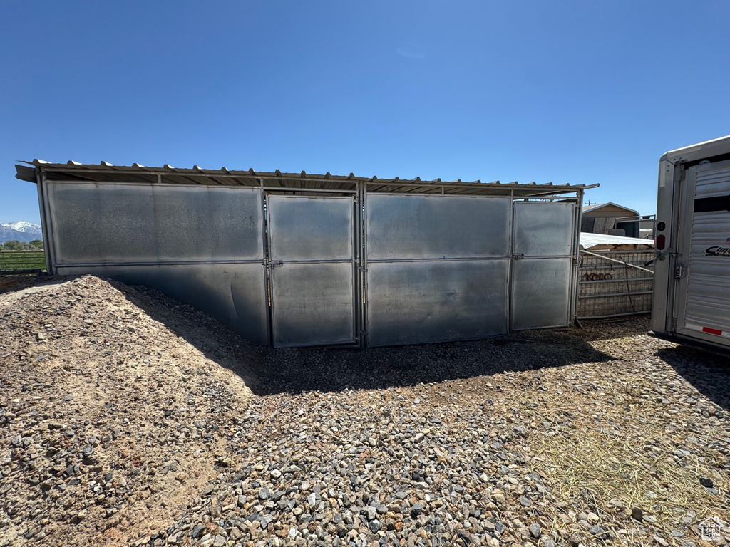 View of outdoor structure featuring fence
