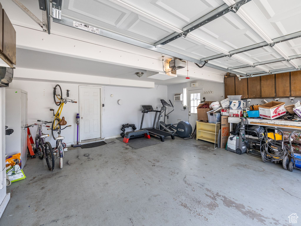 Garage featuring a wall mounted AC