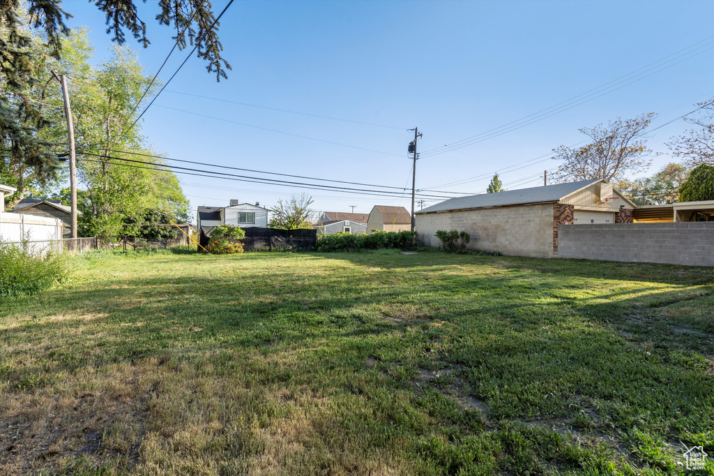View of yard with fence
