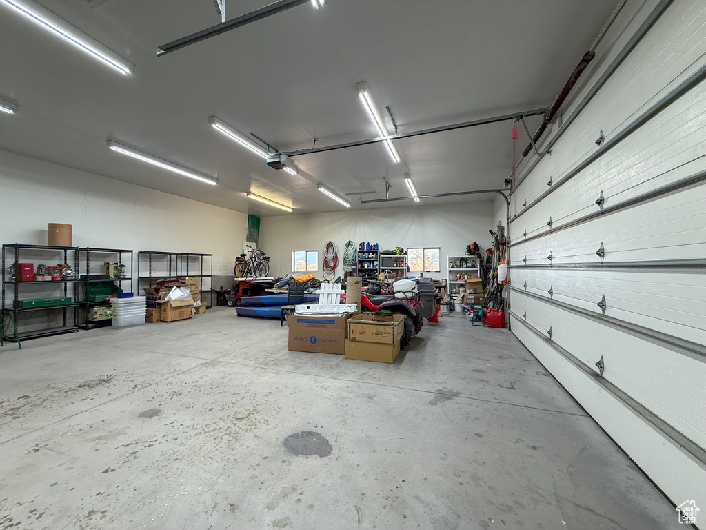 Garage featuring a garage door opener
