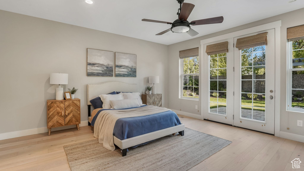 Bedroom featuring baseboards, access to outside, a ceiling fan, and light wood finished floors