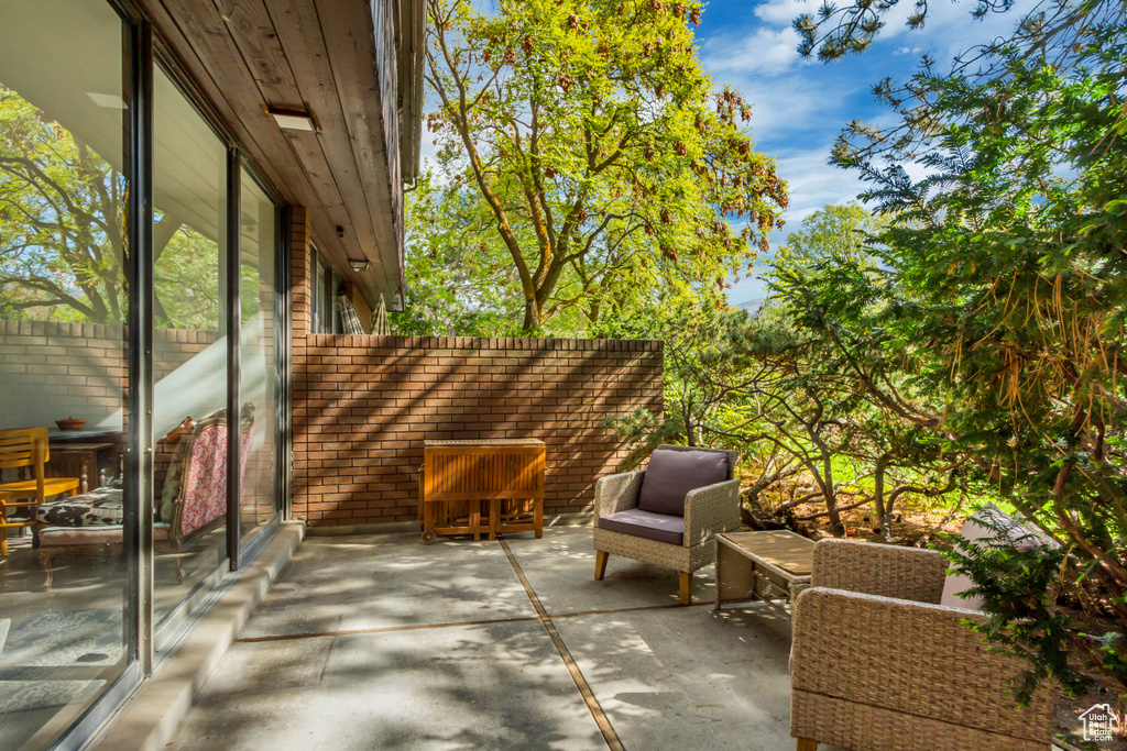 View of patio featuring fence