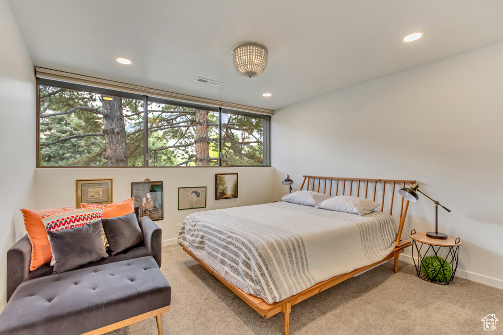 Carpeted bedroom featuring visible vents, recessed lighting, and baseboards