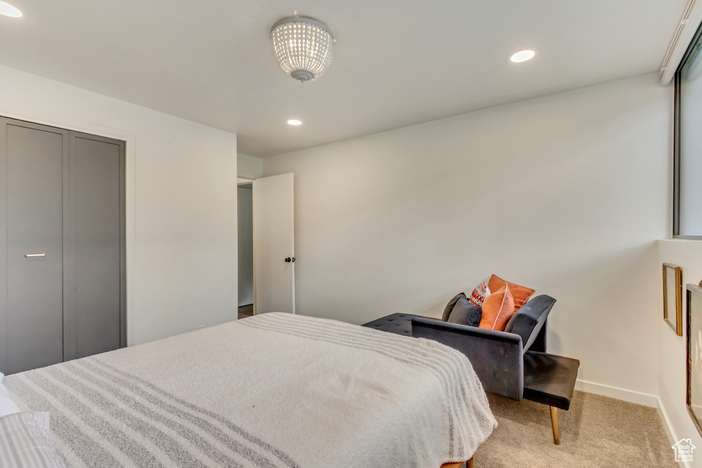 Bedroom with recessed lighting, baseboards, and light carpet
