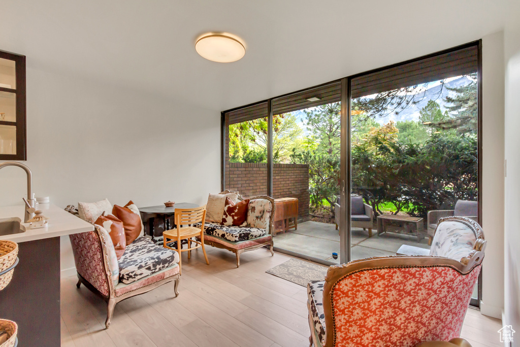 Sunroom featuring a sink and plenty of natural light