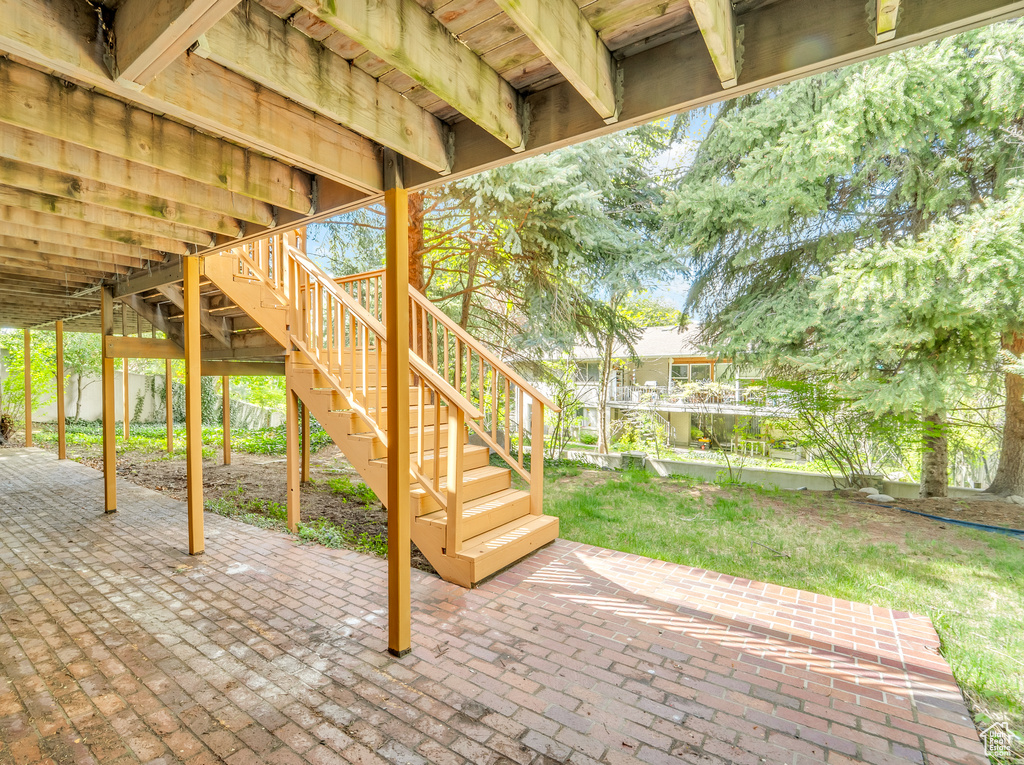 View of patio featuring stairway