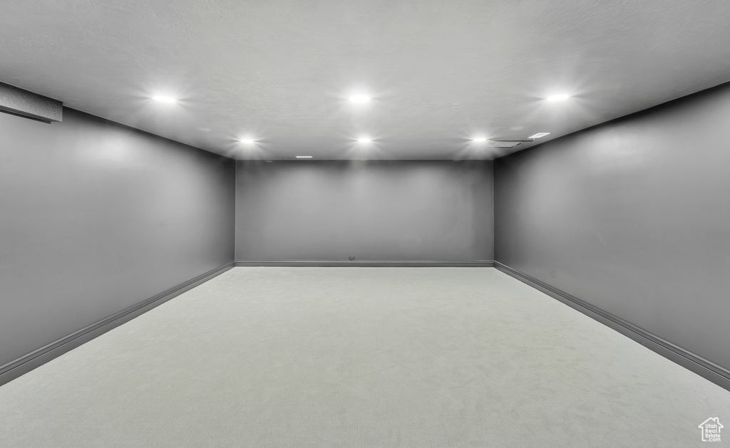 Finished below grade area with recessed lighting and baseboards