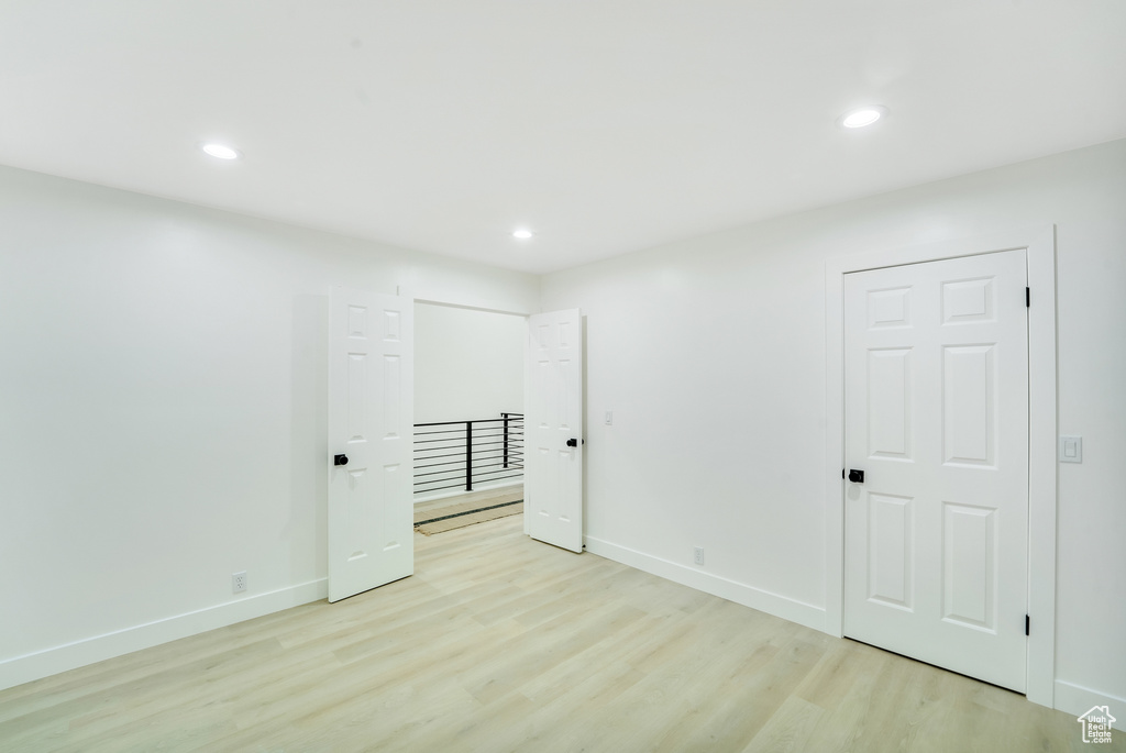 Unfurnished bedroom featuring recessed lighting, baseboards, and light wood finished floors