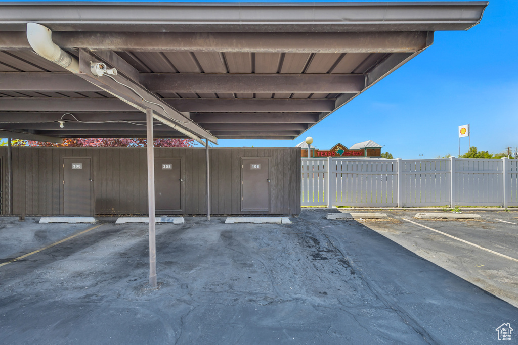 Covered parking lot with fence