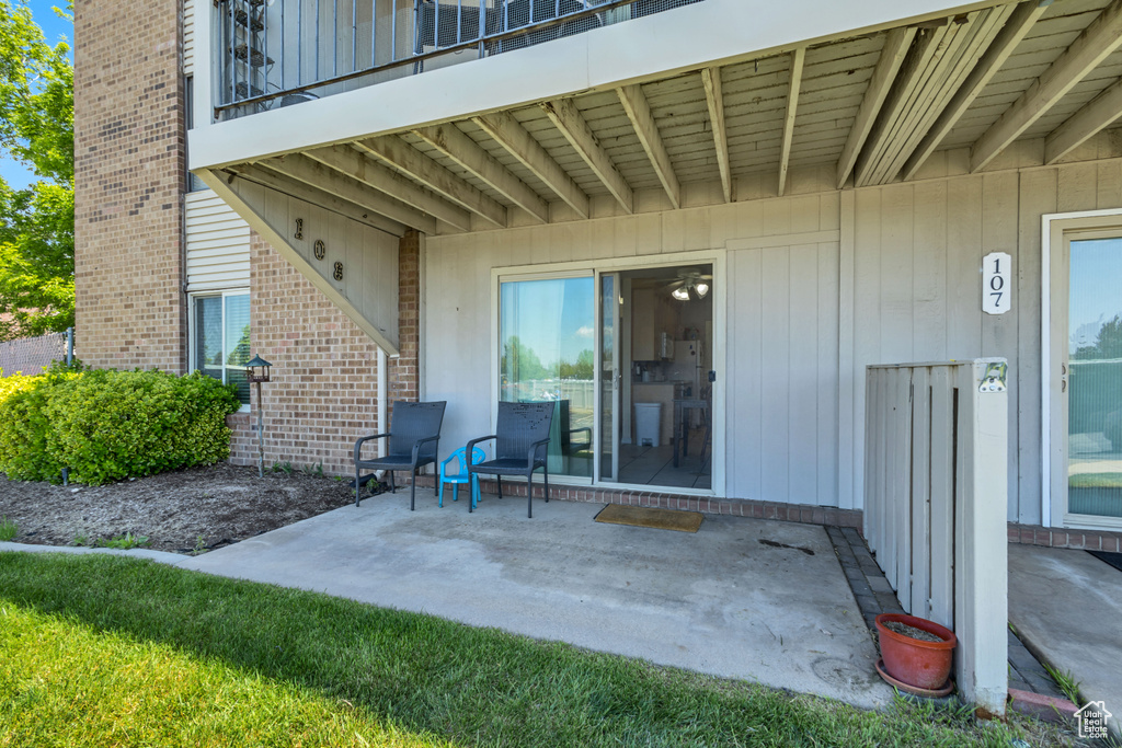 View of patio featuring a balcony