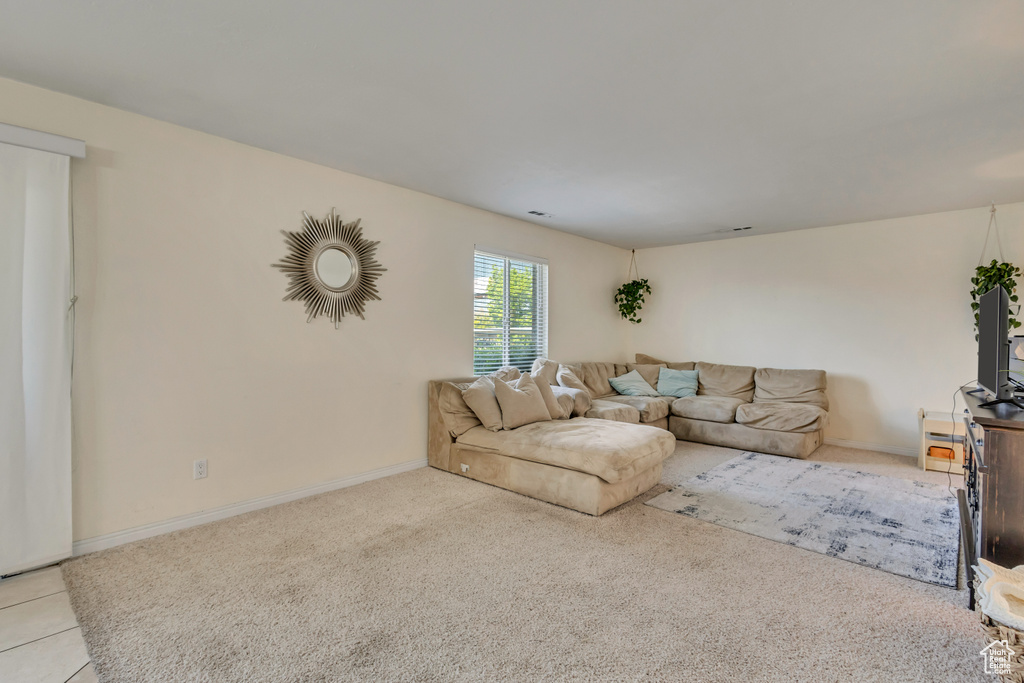 Living room with baseboards and carpet
