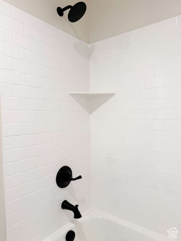 Details featuring shower / bathing tub combination