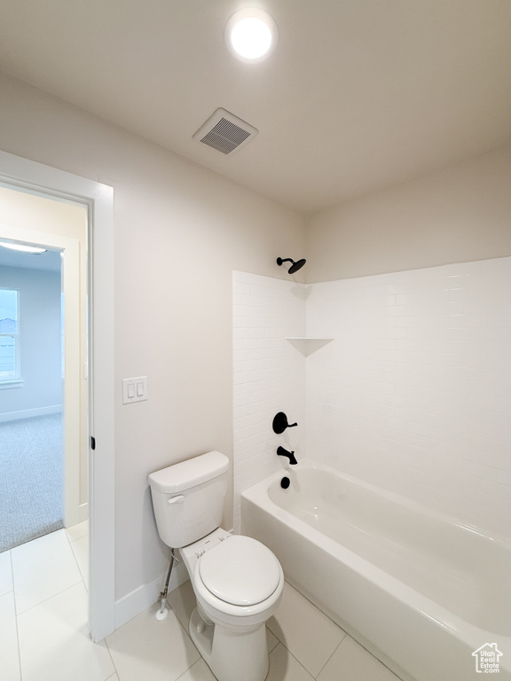 Full bath featuring tile patterned floors, visible vents, toilet, baseboards, and  shower combination