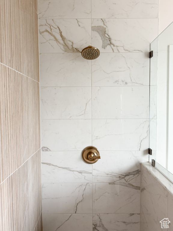 Full bathroom with tiled shower