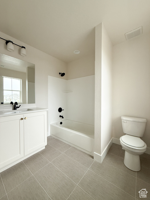 Full bathroom featuring vanity, shower / washtub combination, toilet, tile patterned flooring, and visible vents