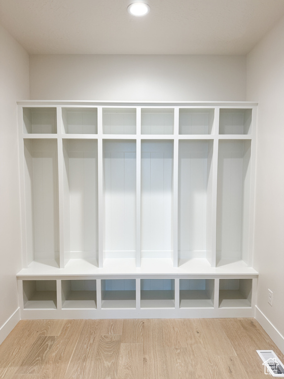Mudroom featuring visible vents, wood finished floors, baseboards, and recessed lighting