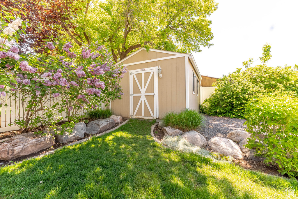 View of shed with fence