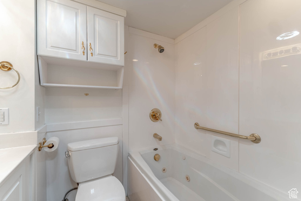 Bathroom with vanity, shower / bathing tub combination, and toilet