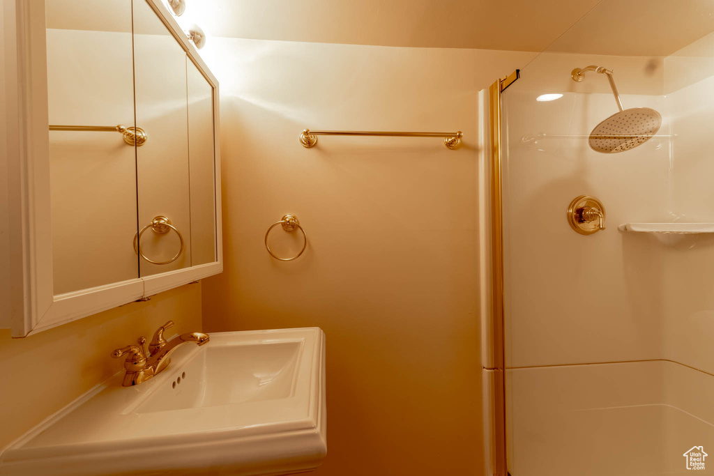 Bathroom with a sink and a shower