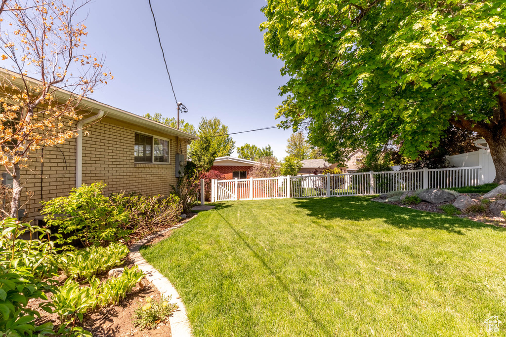 View of yard featuring fence