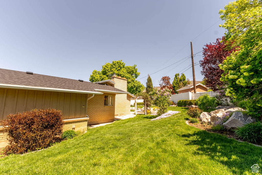 View of yard with fence