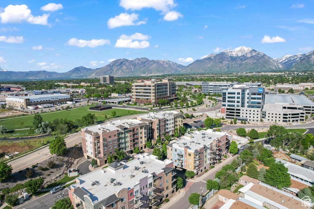 Birds eye view of property with a view of city and a mountain view