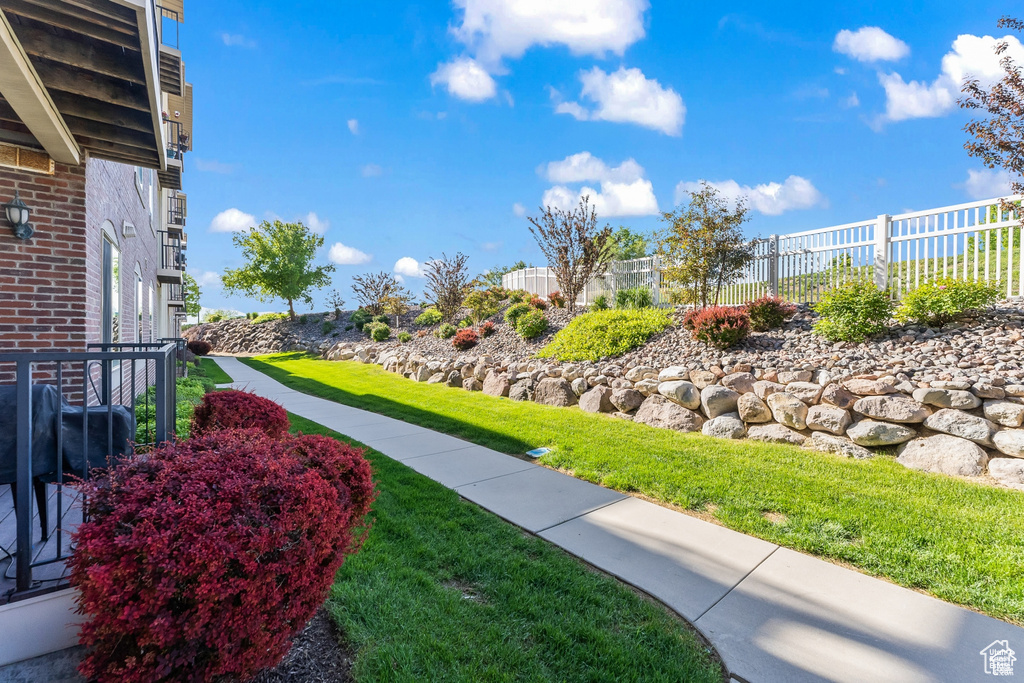 Surrounding community featuring fence and a yard