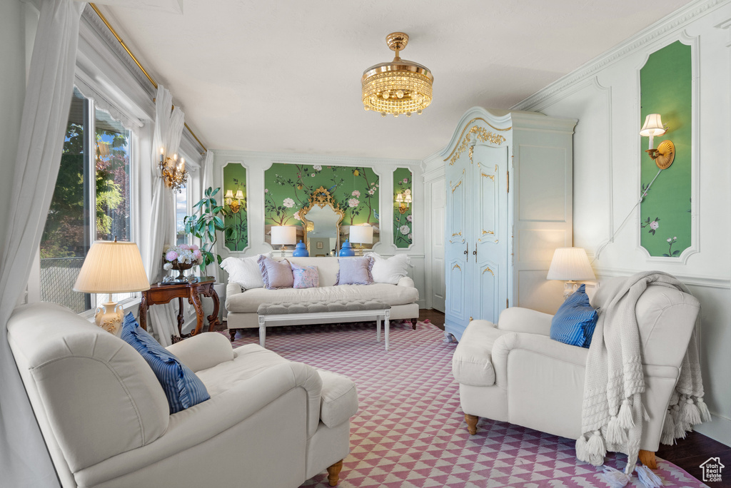 Sunroom / solarium featuring french doors and a chandelier