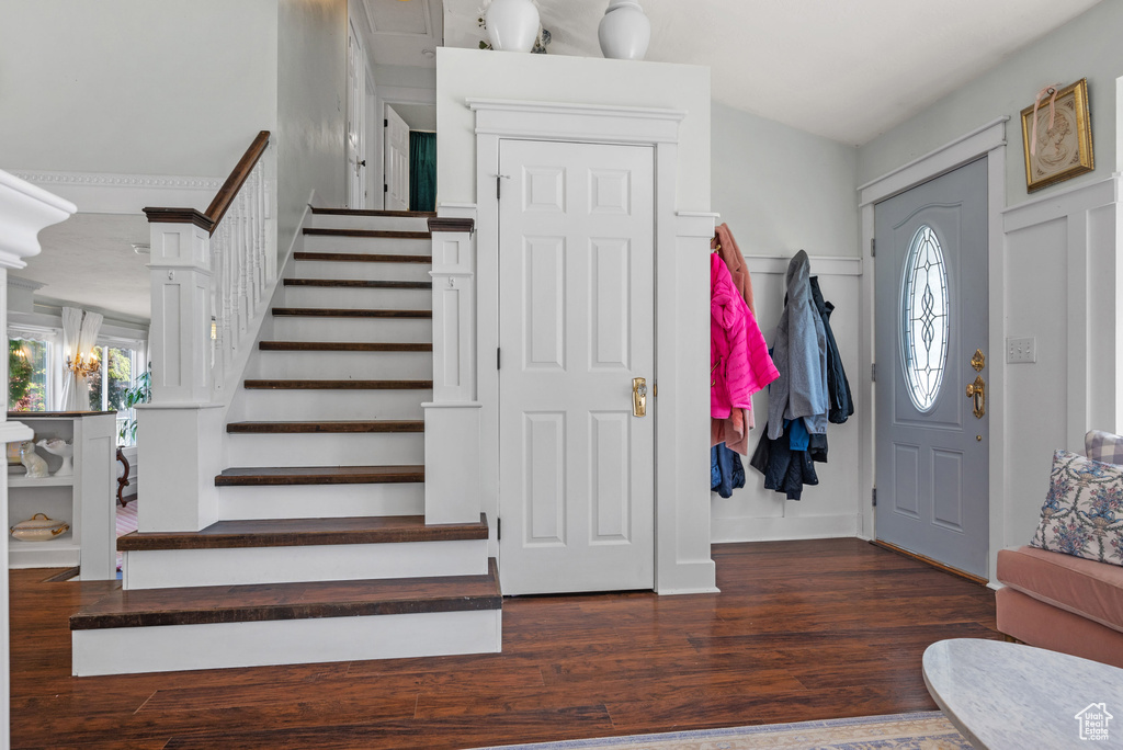 Entryway featuring stairs and wood finished floors
