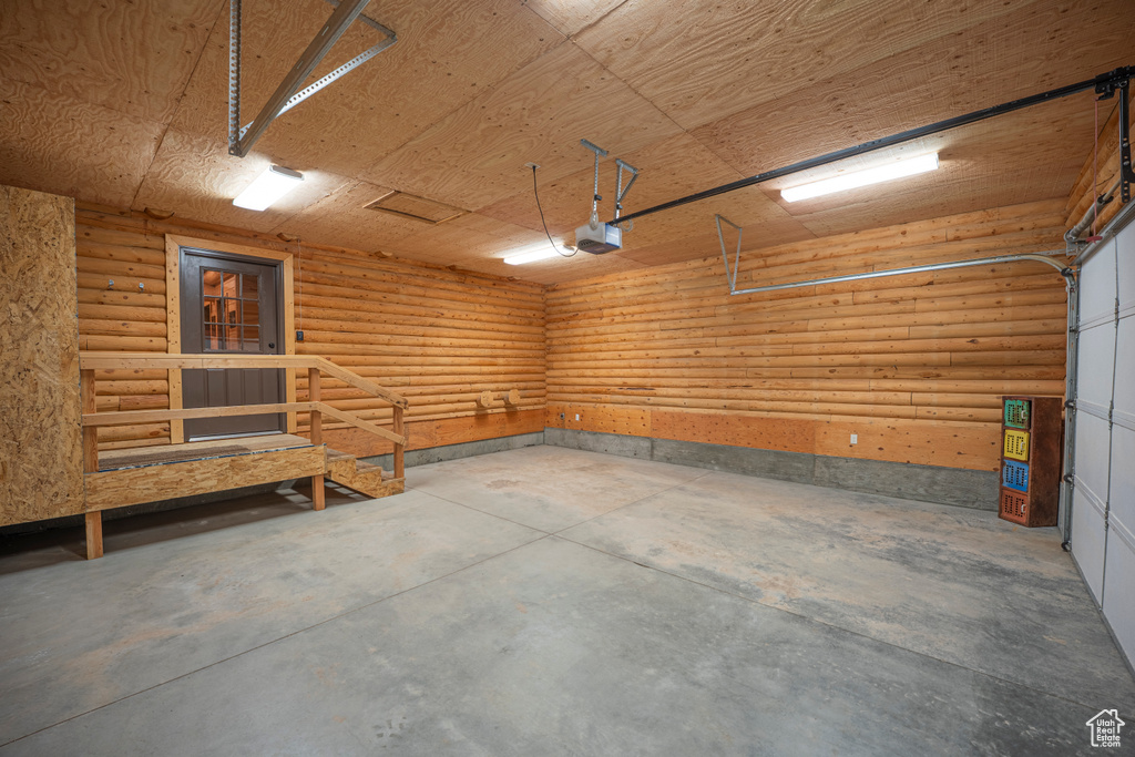 Garage featuring a garage door opener