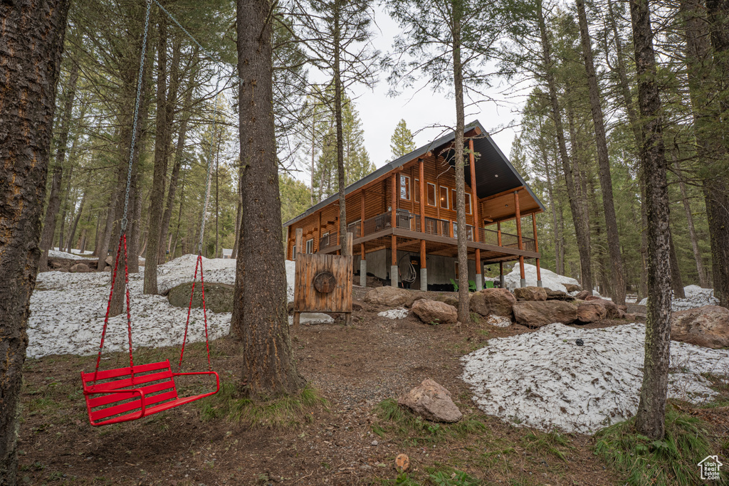 Back of house featuring a deck