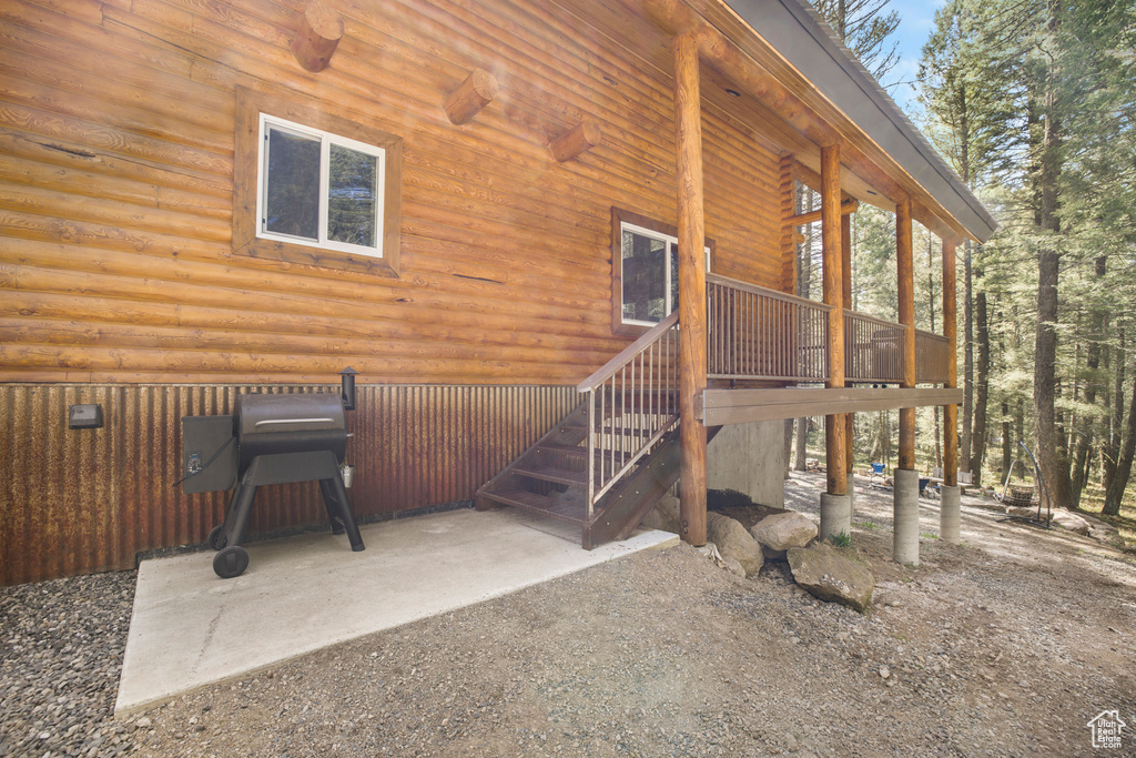 Rear view of house featuring log exterior