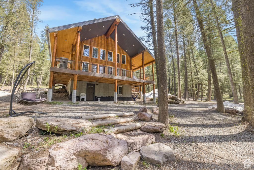Rear view of property with a wooden deck
