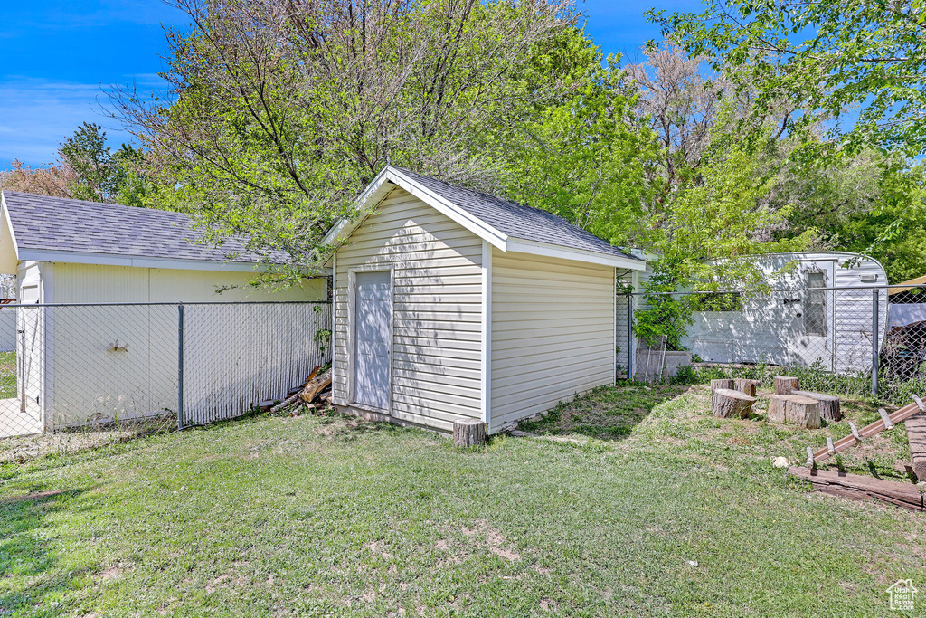 View of shed with fence
