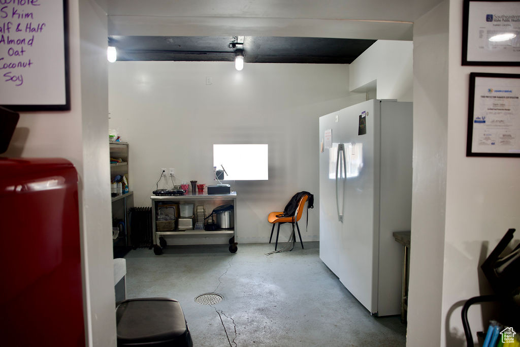 Interior space featuring concrete flooring
