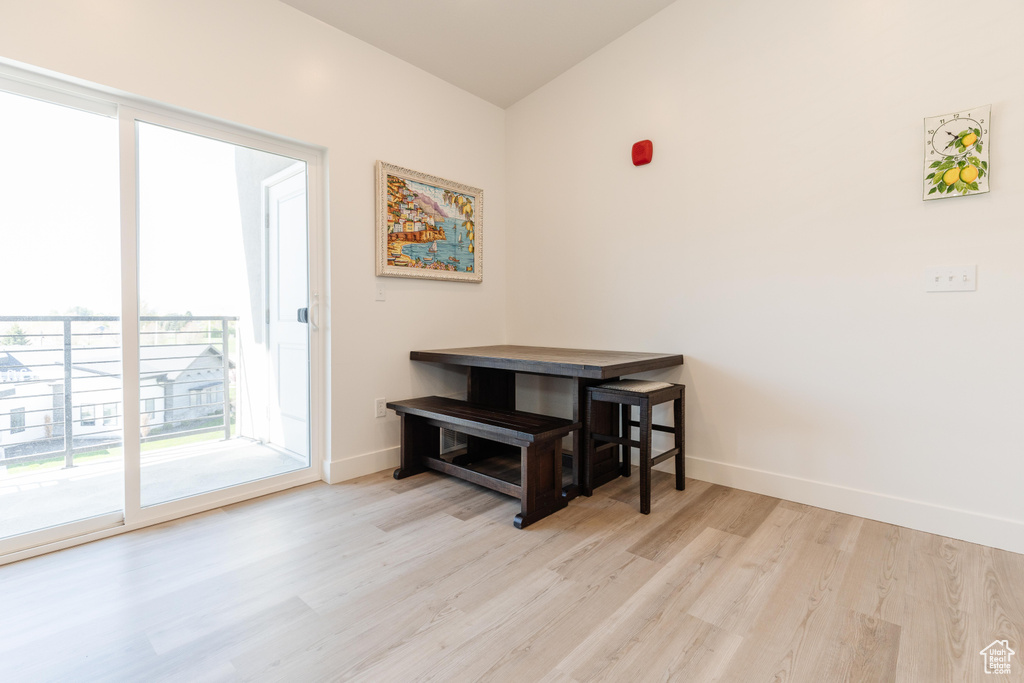 Entryway with baseboards and wood finished floors