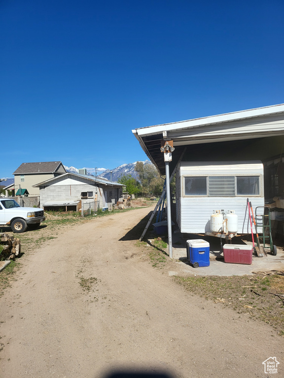 View of side of property with a mountain view