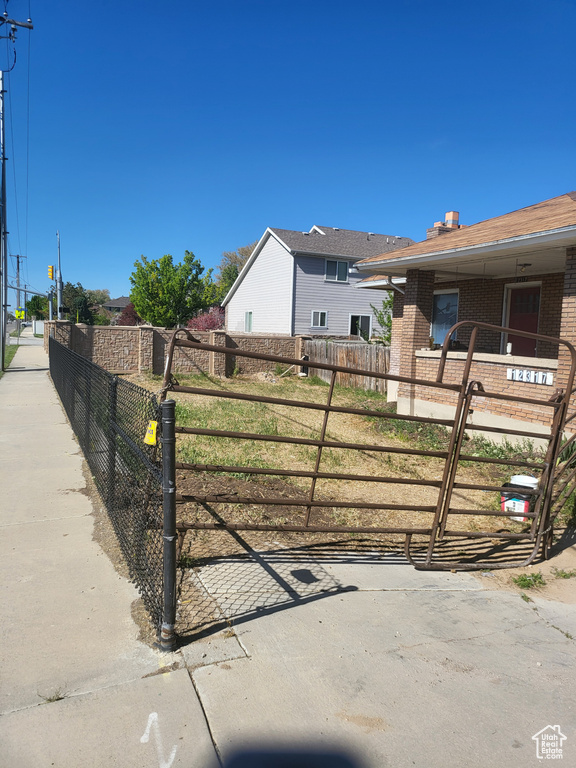 Exterior space with fence and brick siding