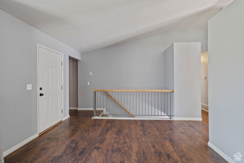 Empty room with baseboards and wood finished floors