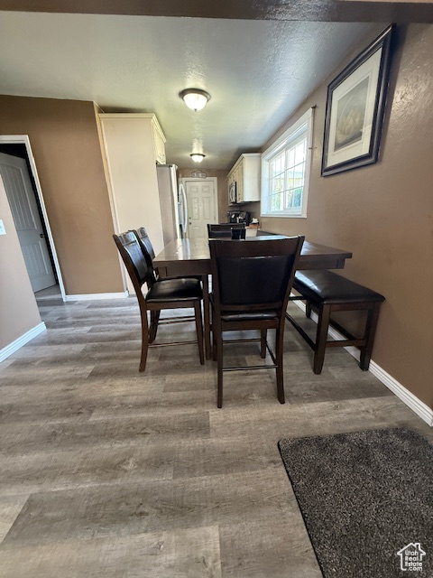 Dining space with wood finished floors
