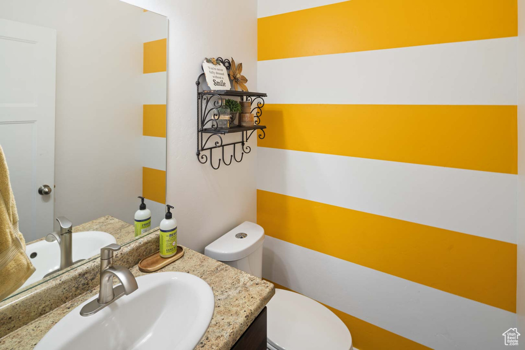 Bathroom with toilet and vanity