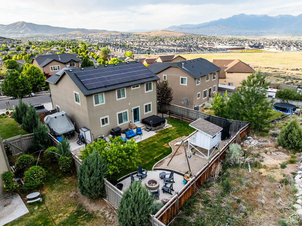 Aerial perspective of suburban area with a mountainous background