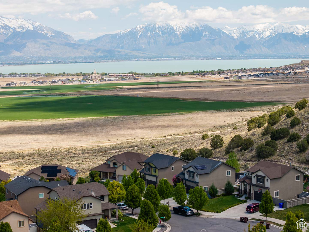 Drone / aerial view with a residential view and a water and mountain view