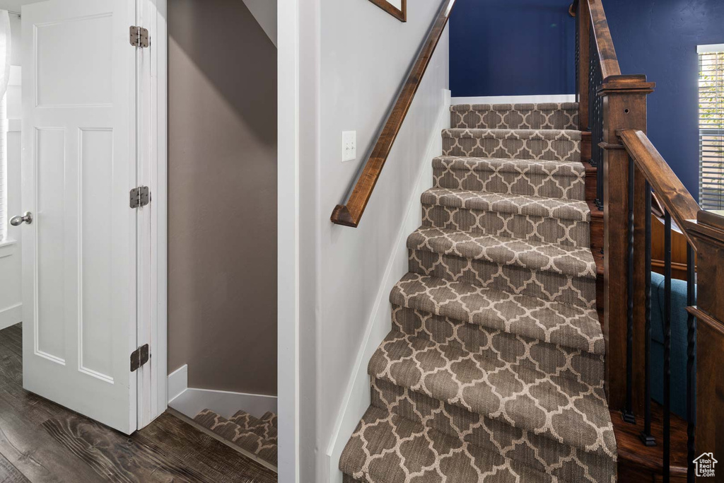 Staircase with wood finished floors