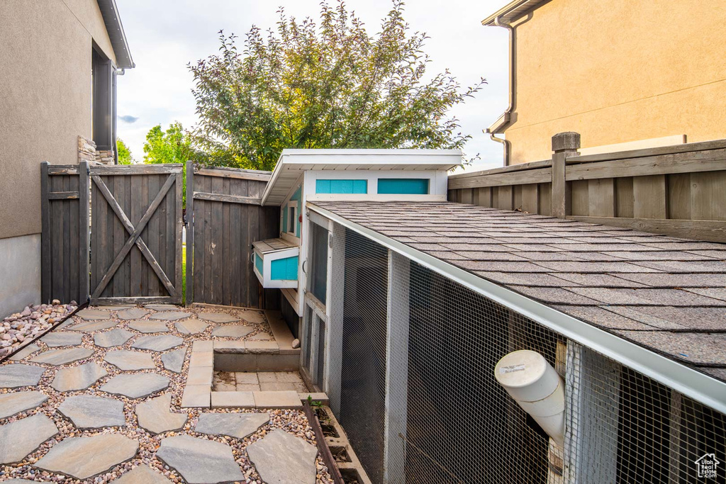 View of patio featuring a gate