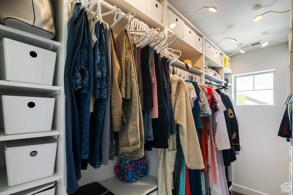 Walk in closet featuring visible vents
