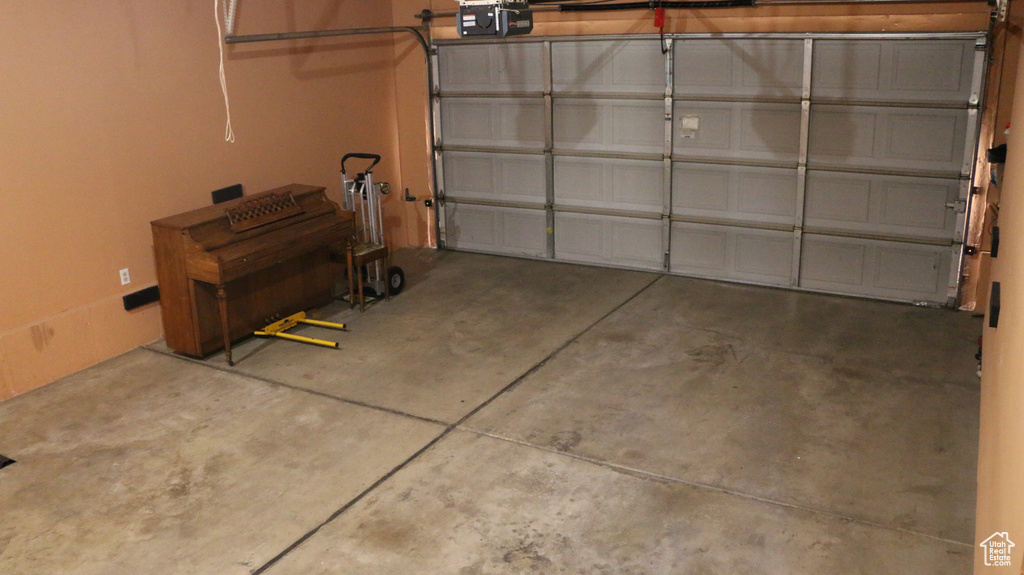 Garage featuring a garage door opener