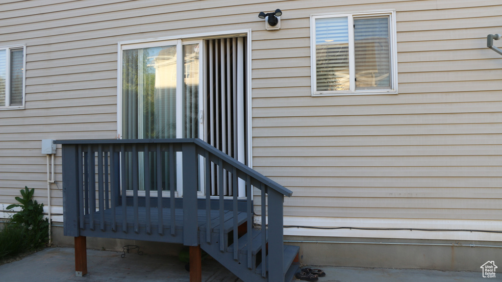 Entrance to property with a wooden deck