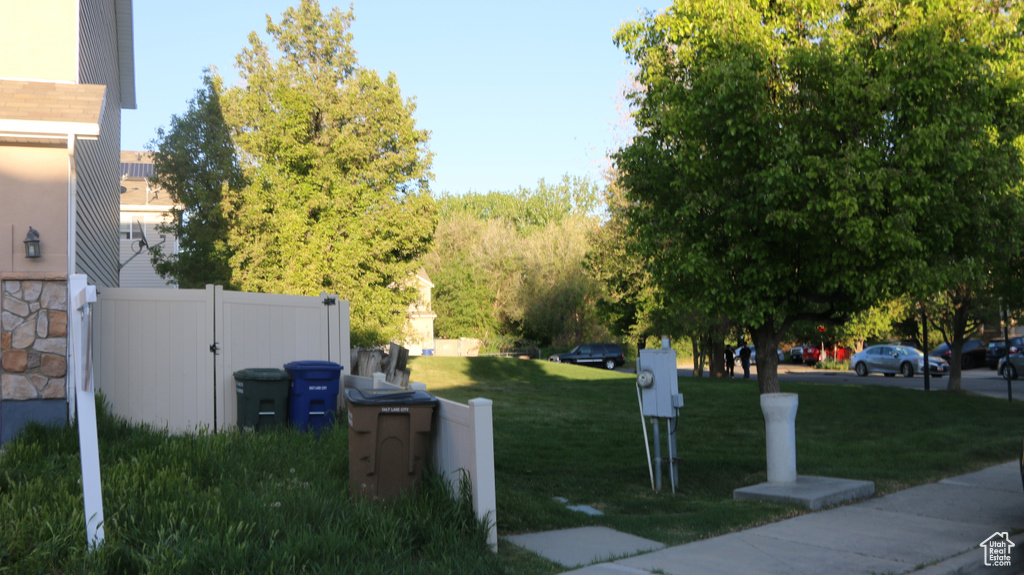 Surrounding community featuring a lawn and fence